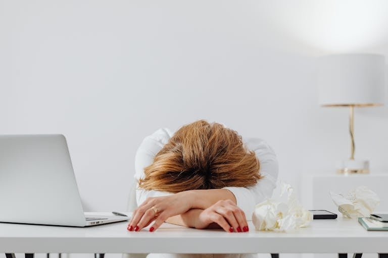 igns of burnout in women — woman looking exhausted